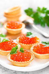 Tartlets with red salmon fish caviar, salmon caviar. Caviar