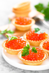 Tartlets with red salmon fish caviar, salmon caviar. Caviar