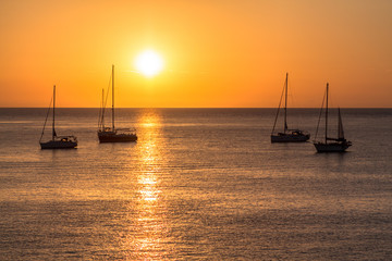Sailboats at sunset