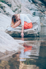 Beautiful young woman relaxing in the nauture on the spring day