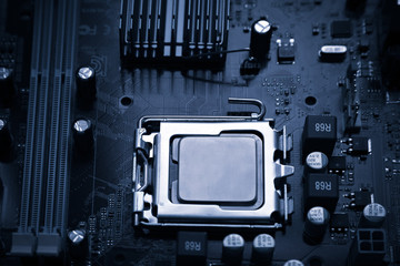 Toned surface and texture of the processor socket on the motherboard.