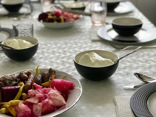 Turkish Food Yogurt with Pickle at Dinner Table.