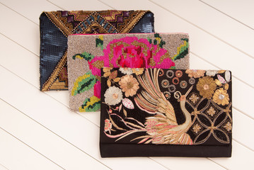 embroidered handbags, three handbags with embroidery, clutches of envelope shape, black clutch, fashionable clutches