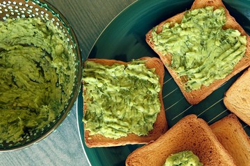 Toasted bread with guacamole. Homemade  avocado dip with dill.