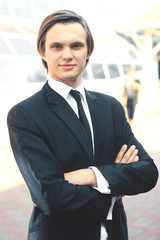 portrait of a young businessman on blurred background