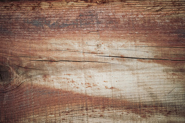 Fototapeta premium Wood texture in brown tones. Old rural wooden wall, detailed plank fence photo background.