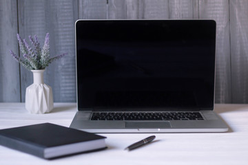 laptop and documents in the workplace.