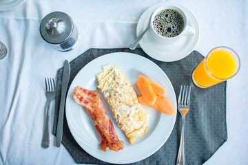 Healthy tasty american breakfast on table in outdoor cafe