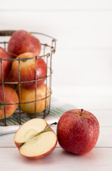 Beautiful Fresh Apples on a White Wooden Table