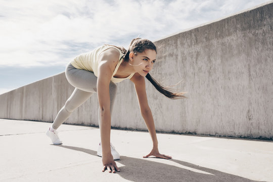 Confident Young Girl Running Around In The Open Air, Doing Sports And Getting Ready For A Marathon