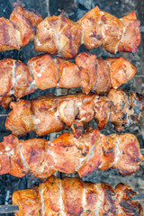 top view of grilled meat on bbq mangal outdoors.
