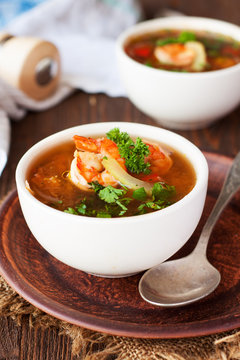 Tomato soup with tilapia, shrimp and capers