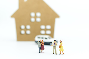 Miniature people: Family  ,consultants on financial transactions for home loan, miniature people. Image use for financial, business concept.