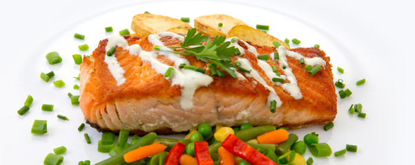 Salmon Steak with Vegetables and fried potatoes.