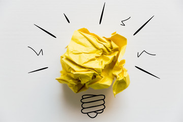 Creative idea. Concept of idea and innovation with yellow paper ball and light bulb