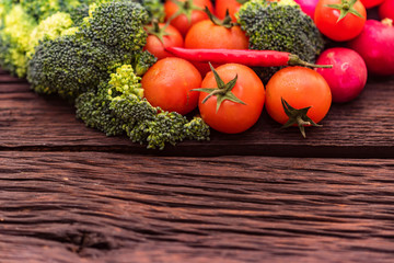 Fresh seasonal vegetables on wooden surface