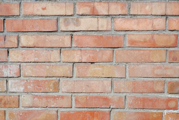 Obraz premium Old brick wall, old texture of red stone blocks closeup