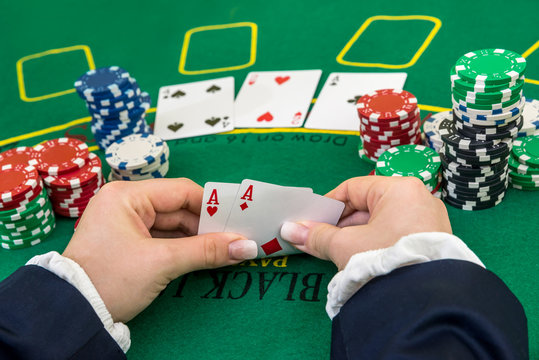 Woman showing combination of two aces, poker