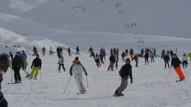 People skiing and snowboarding 