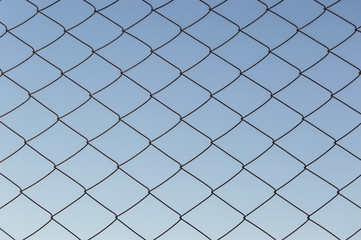fence mesh against the sky