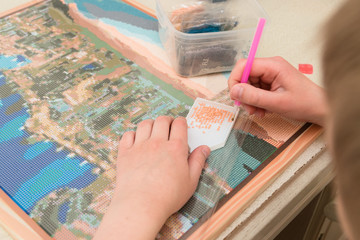 Diamond embroidery. Colored crystals. Needlework. Creation. Spend your free time with benefit....