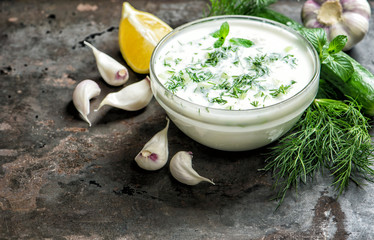 Tzatziki sauce ingredients cucumber garlic food background