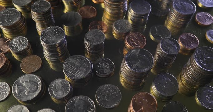 Coins Stacked on Gold Background Rotating