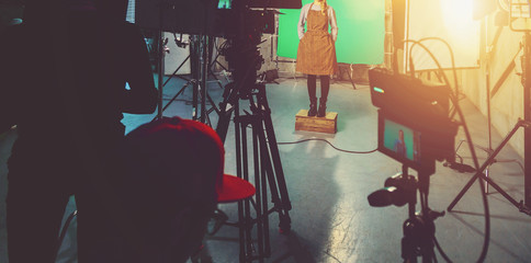 actress in studio posing on green screen