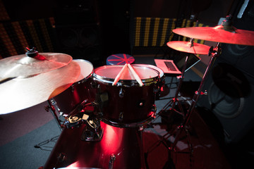 Background of modern profession drum set in empty  recording studio, copy space