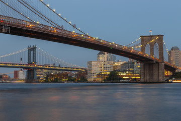 Fototapeta na wymiar Sunset view of Manhattan Bridge and Brooklyn Bridge, New York