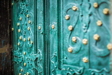 Ancient green door to cathedral, closeup