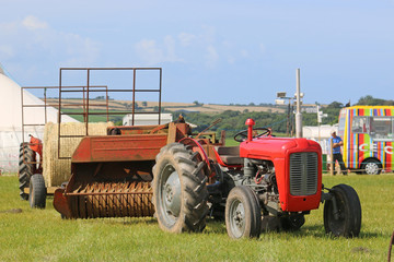 Vintage tractor pulling a baler