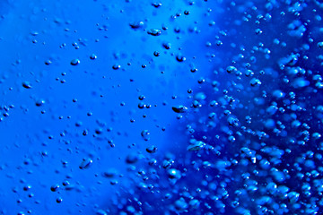 Blue clear water with bubbles, abstract liquid background