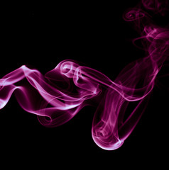 Fototapeta premium Colored smoke on black background.