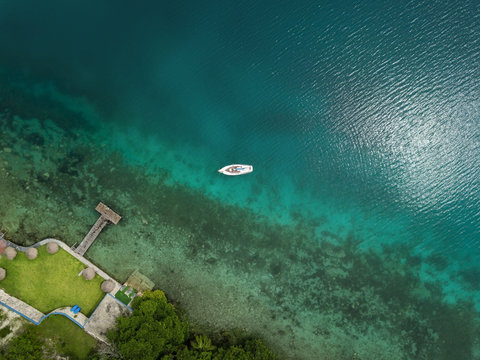 Sailing boat at the coast - view from above