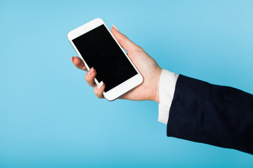 Female hand holding a phone