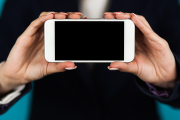 Female hand holding a phone