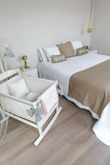 Sober and elegant bedroom with double bed and cot with canopy