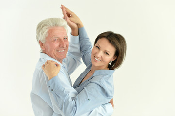 Portrait of senior man with adult daughter dancing