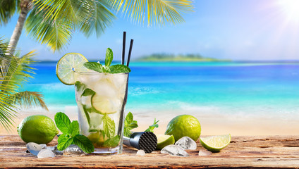 Fresh Mojito Drink On Table In Tropical Beach
