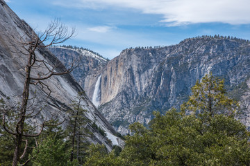 waterfalls and rivers through the mountains at yosemite 
