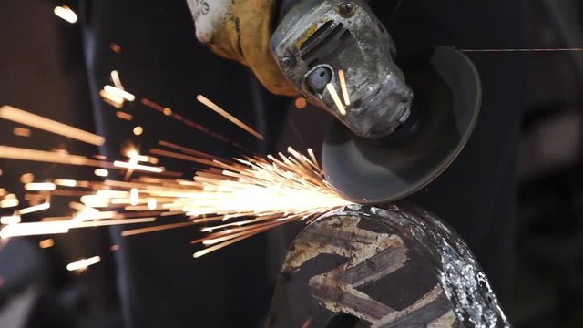 Angle Grinder Sparks Old MetalWorker cutting Old Metal using angular grinding machine