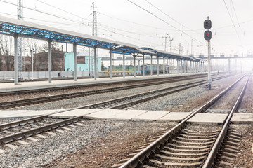 Fototapeta na wymiar Empty railway station. Railroad transportation desolation concept