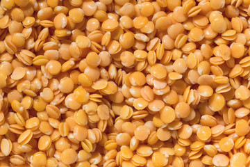 Red lentils texture background. Close-up healthy organic lentil seed. Natural nutriotion diet