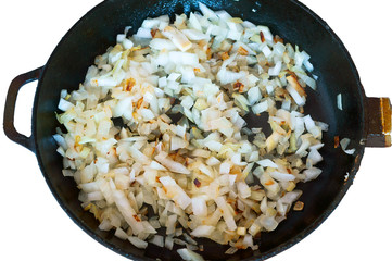Onions and carrots in the pan. Roast for soup. Saute the vegetables for the soup in the pan.