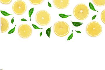 Slices lemon decorated with green leaves isolated on white background with copy space for your text. Flat lay, top view