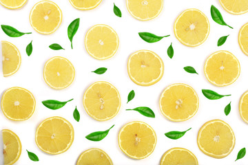 Naklejka na ściany i meble Slices lemon decorated with green leaves isolated on white background. Flat lay, top view