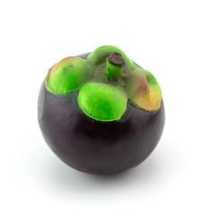 Plastic grape fruit, decorated with artificial  accessory, on white background, clipping path