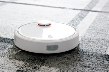 Robotic vacuum cleaner cleaning the room