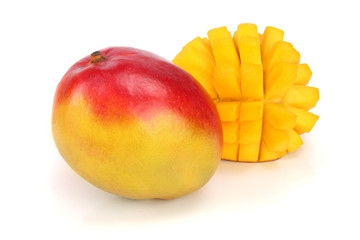 Mango fruit and half isolated on white background close-up